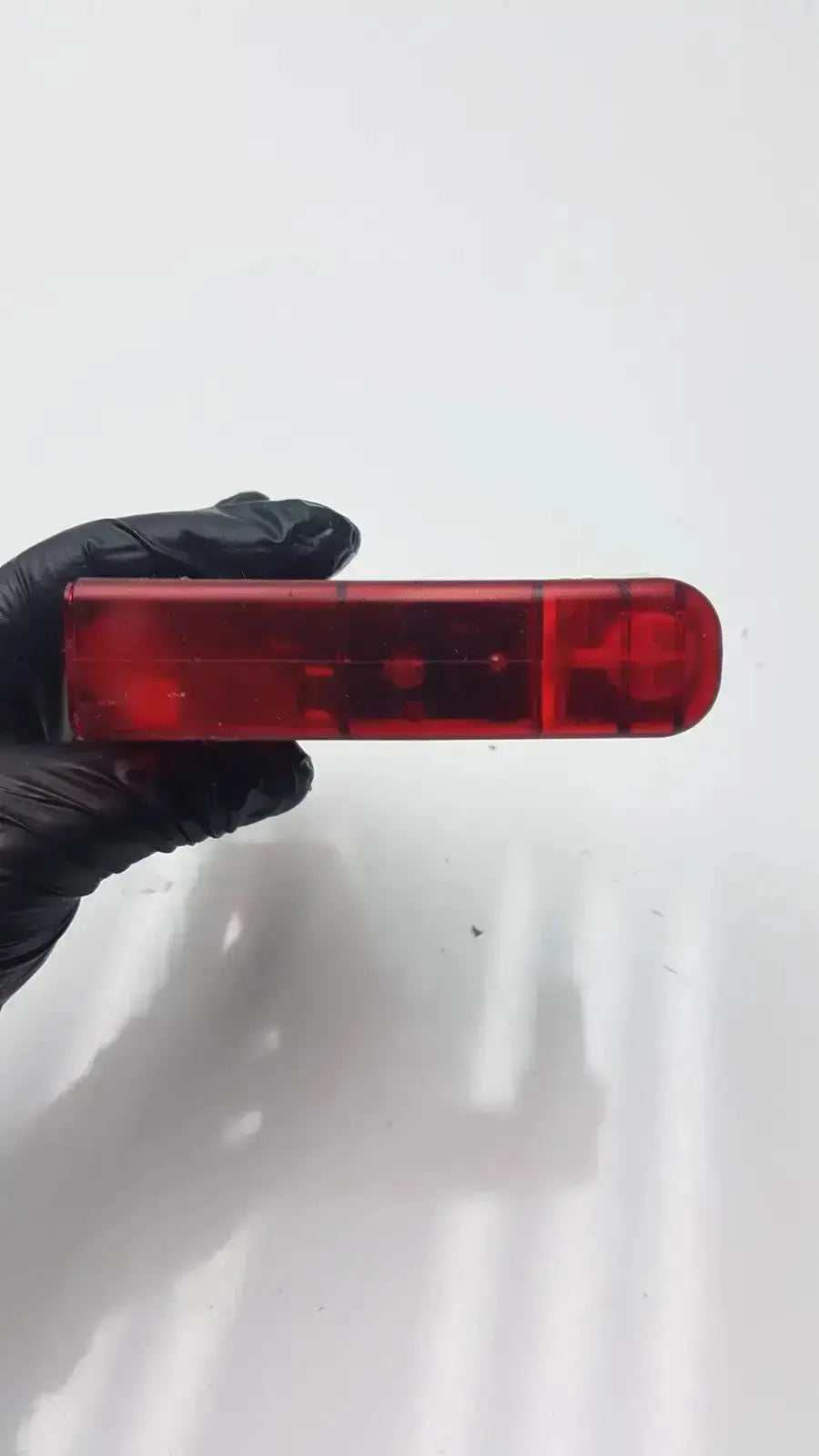 Red translucent plastic vape pen with modern design featured in integra biosciences acu pipetboy controller product image