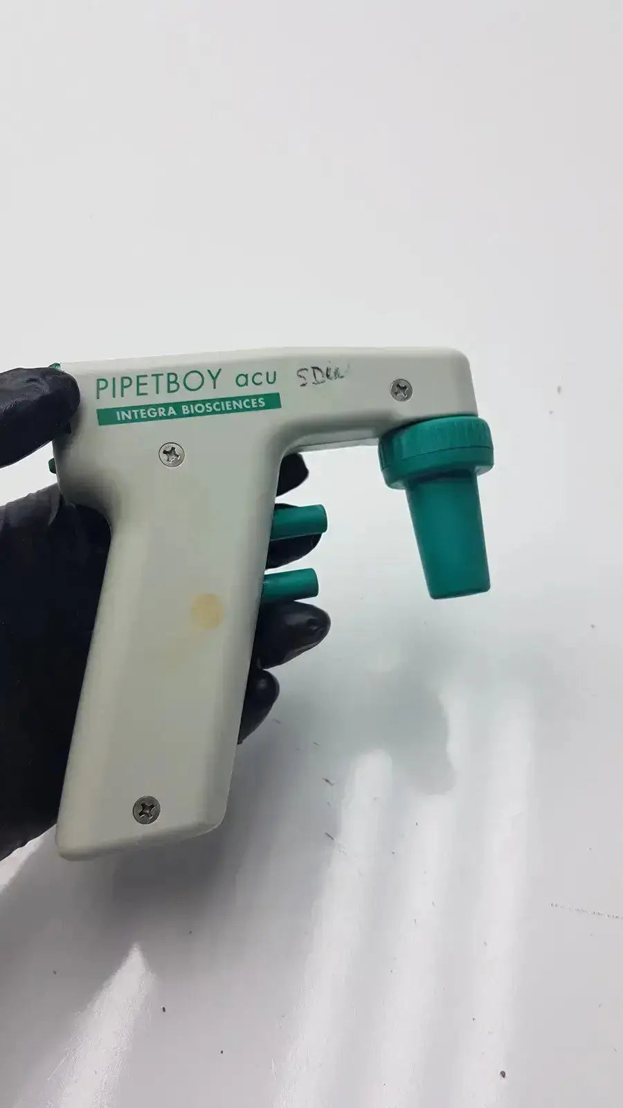 White and teal integra biosciences acu pipetboy controller with green accents for precise liquid handling