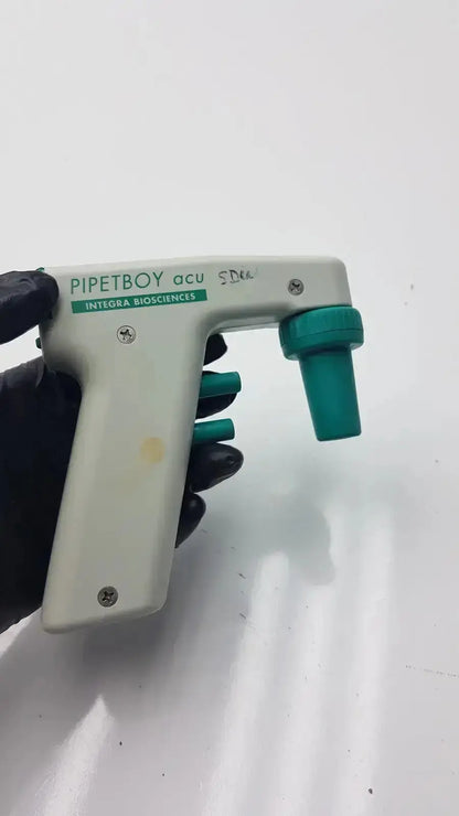 White and teal integra biosciences acu pipetboy controller with green accents for precise liquid handling