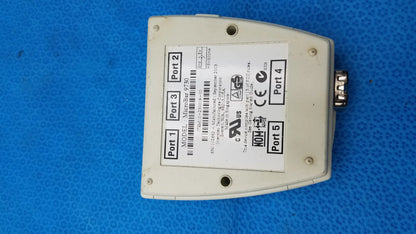 Off-white plastic intermec microbar 9730 decoder wedge back side with five labeled ports and metallic connector for reuse medical equipment