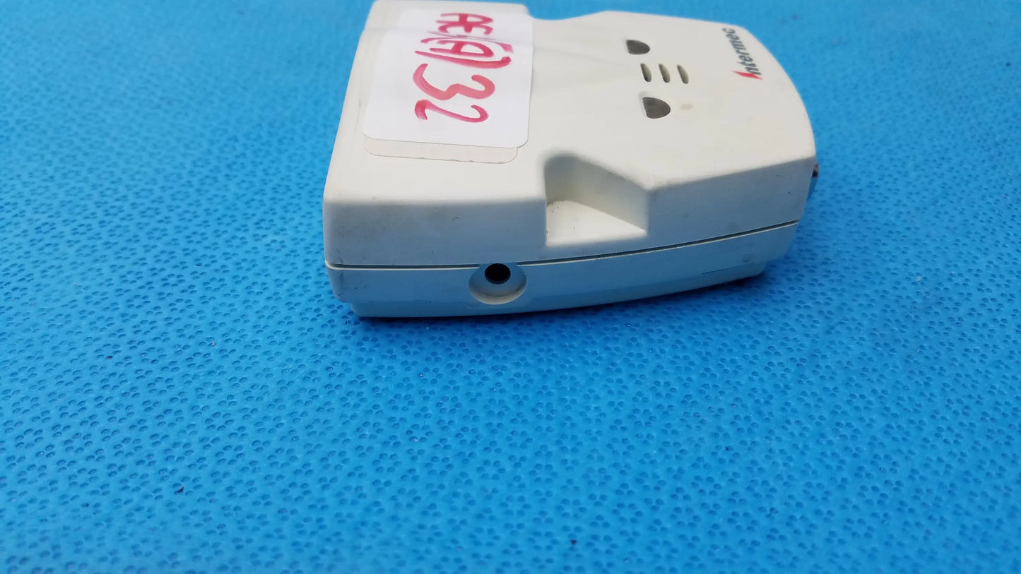 White plastic medical equipment decoder wedge with red handwritten label and intermec logo for reuse medical use