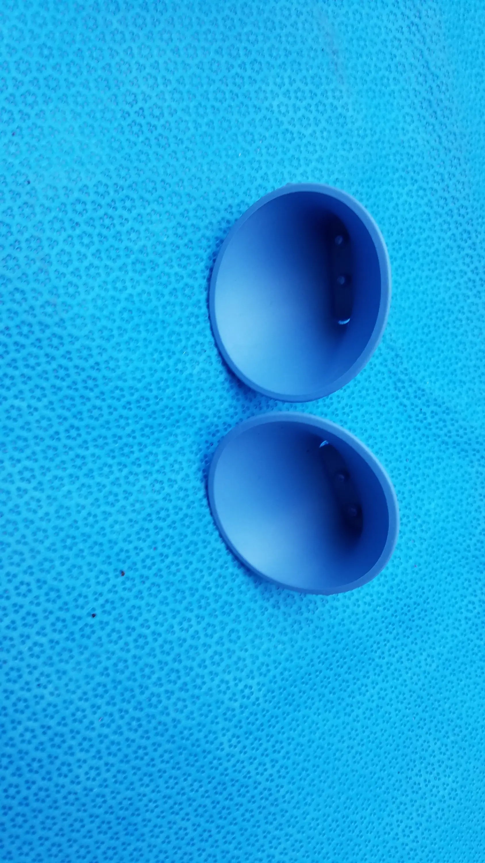 Two matte blue plastic dome-shaped caps for intoximeters alco-sensor fst portable handheld medical equipment by smiths medical