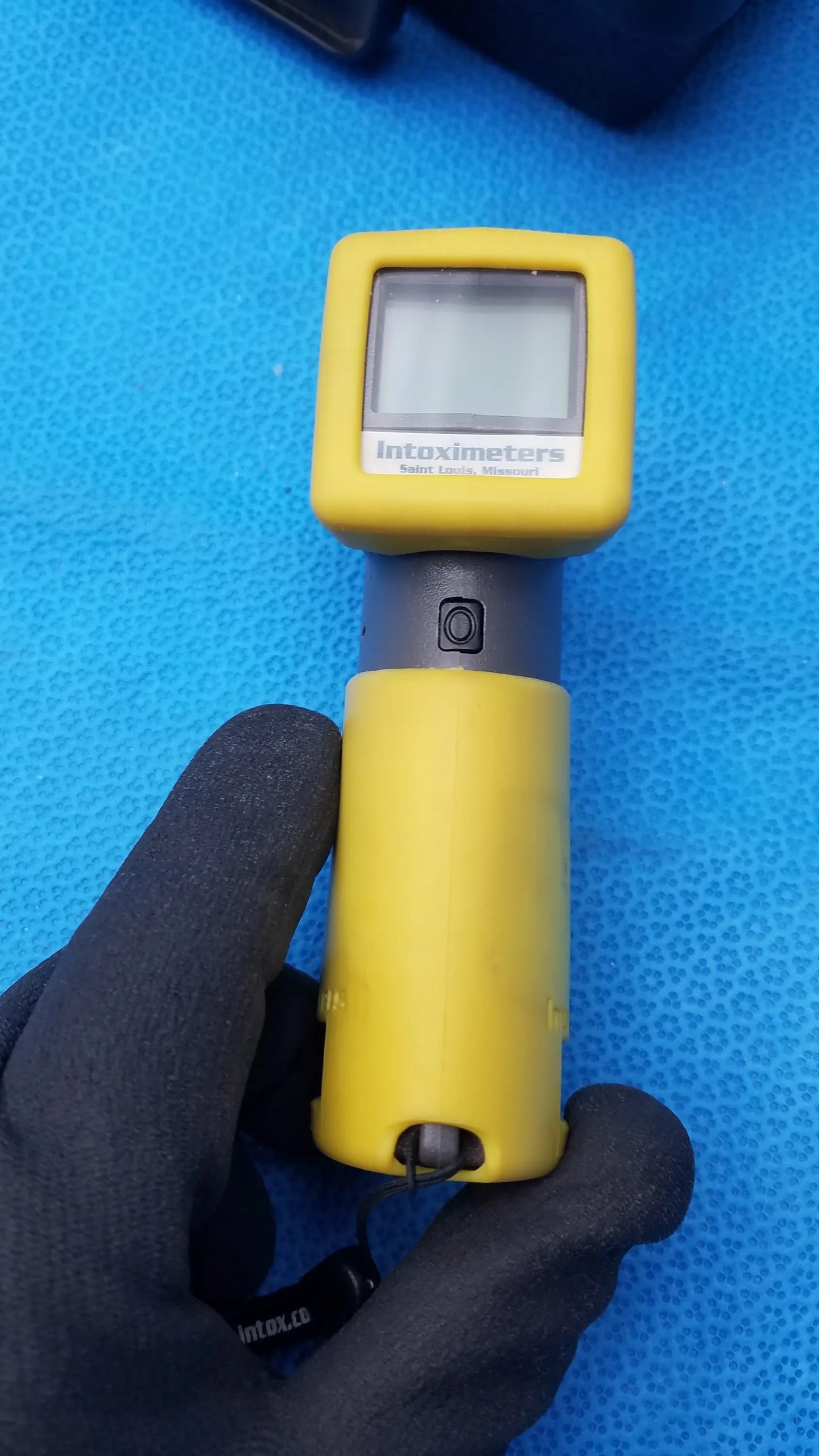 Yellow intoximeters alco-sensor FST portable handheld alcohol test breathalyzer with gray grip digital display medical equipment