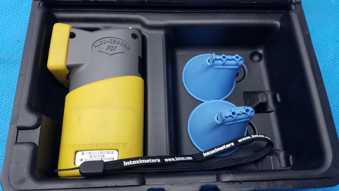 Yellow and gray intoximeters alco-sensor fst portable handheld breathalyzer with blue suction cups in black case medical equipment