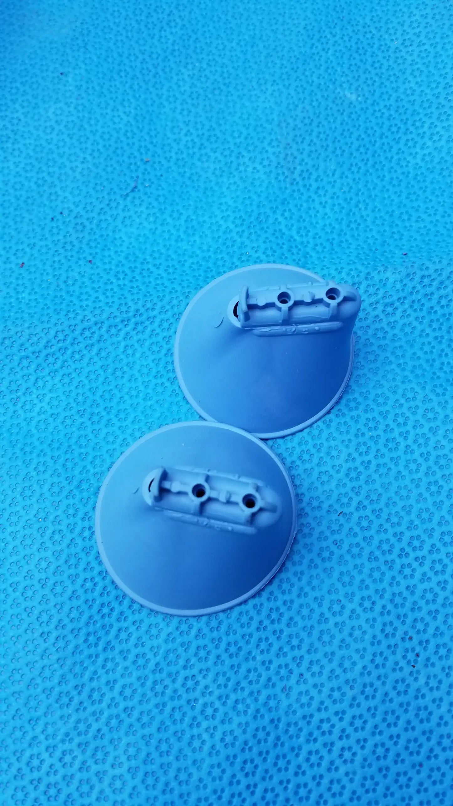 Light gray circular plastic suction cup attachments with three holes for intoximeters alco-sensor fst portable handheld medical equipment