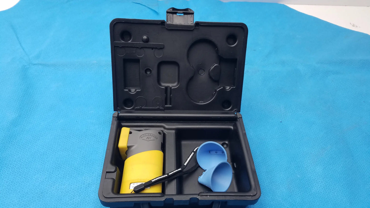 Intoximeters alco-sensor fst portable handheld yellow and black breathalyzer with blue attachment in black molded case medical equipment