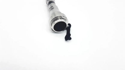 Silver metallic cylindrical connector with black rubber seal and clip for reuse medical equipment Intuitive Surgical cannula