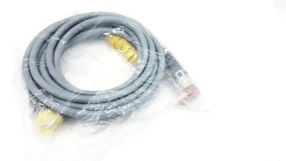 Gray coiled gas hose with yellow and red connectors in clear plastic packaging for intuitive surgical daVinci camera connecting cable