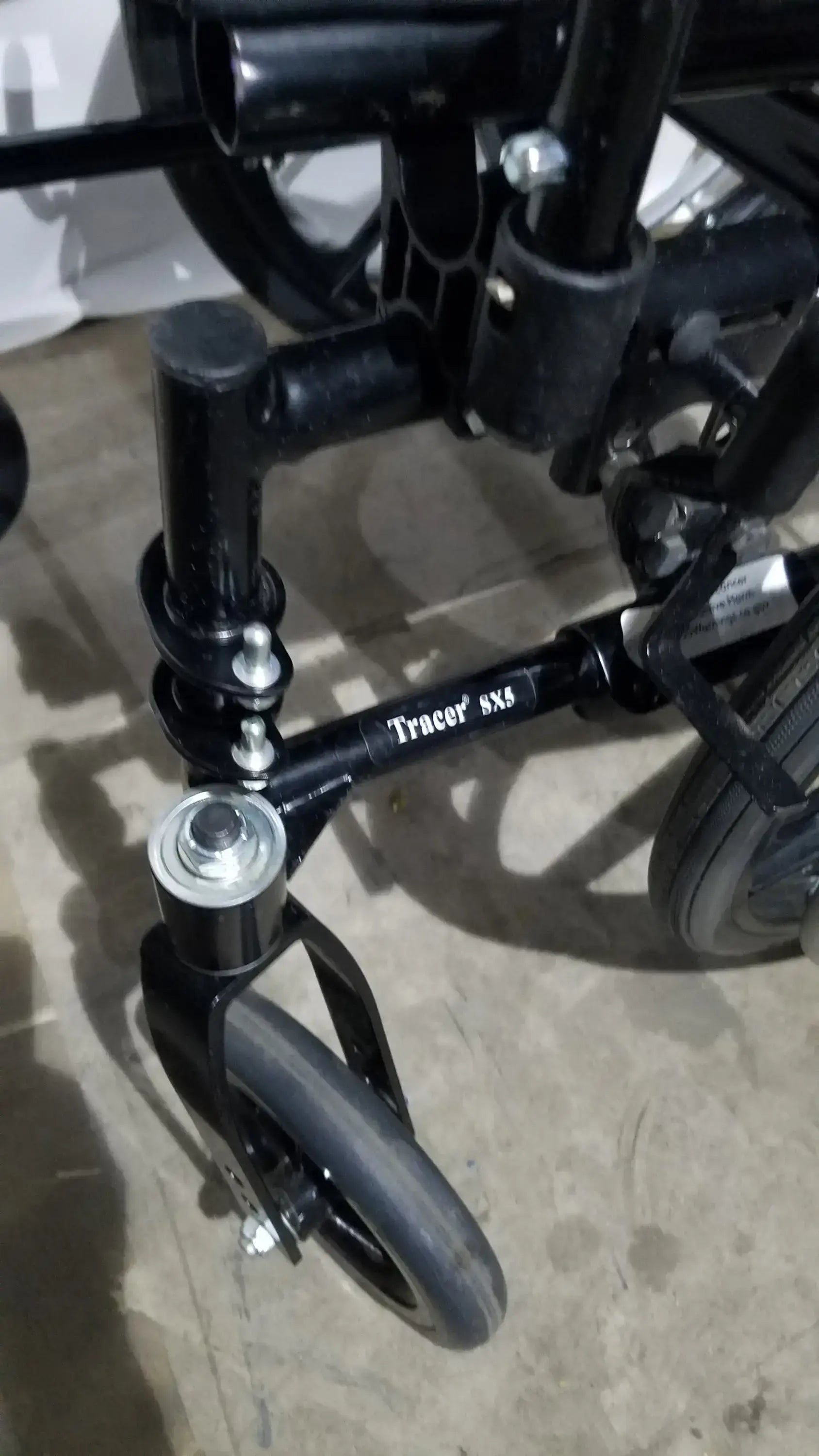Invacare Tracer SX5 Folding Wheelchair – Black Finish with Padded Arm Supports