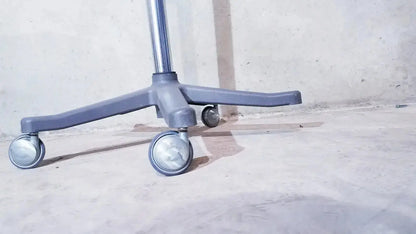 Gray plastic office chair base with four swivel casters and metal pole for ivac corporation vital check 4200 with stand