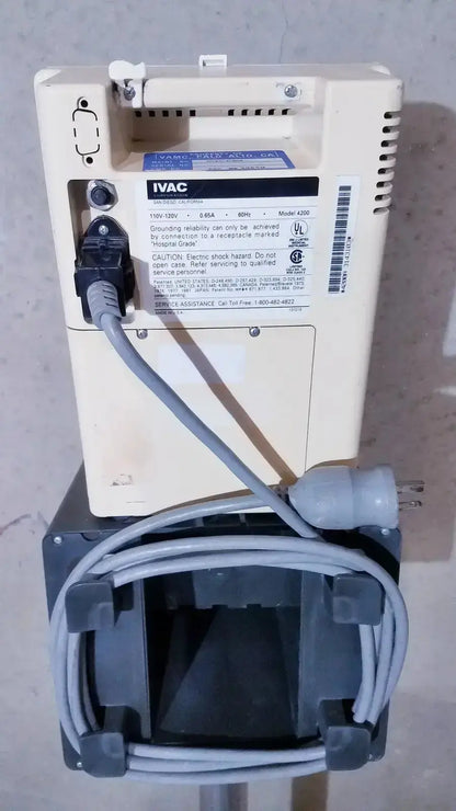 Beige ivac a206 industrial power supply unit with gray cables and black base in ivac corporation vital check 4200 with stand