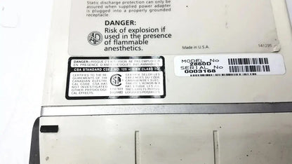 White plastic ivac medsystem iii patient monitor 2860d device with black labeling and barcode model 2860d on back side