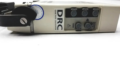 Beige plastic drc dose rate calculator with black rotary dial and multiple circular ports on alaris ivac medsystem iii patient monitor 2860d back side