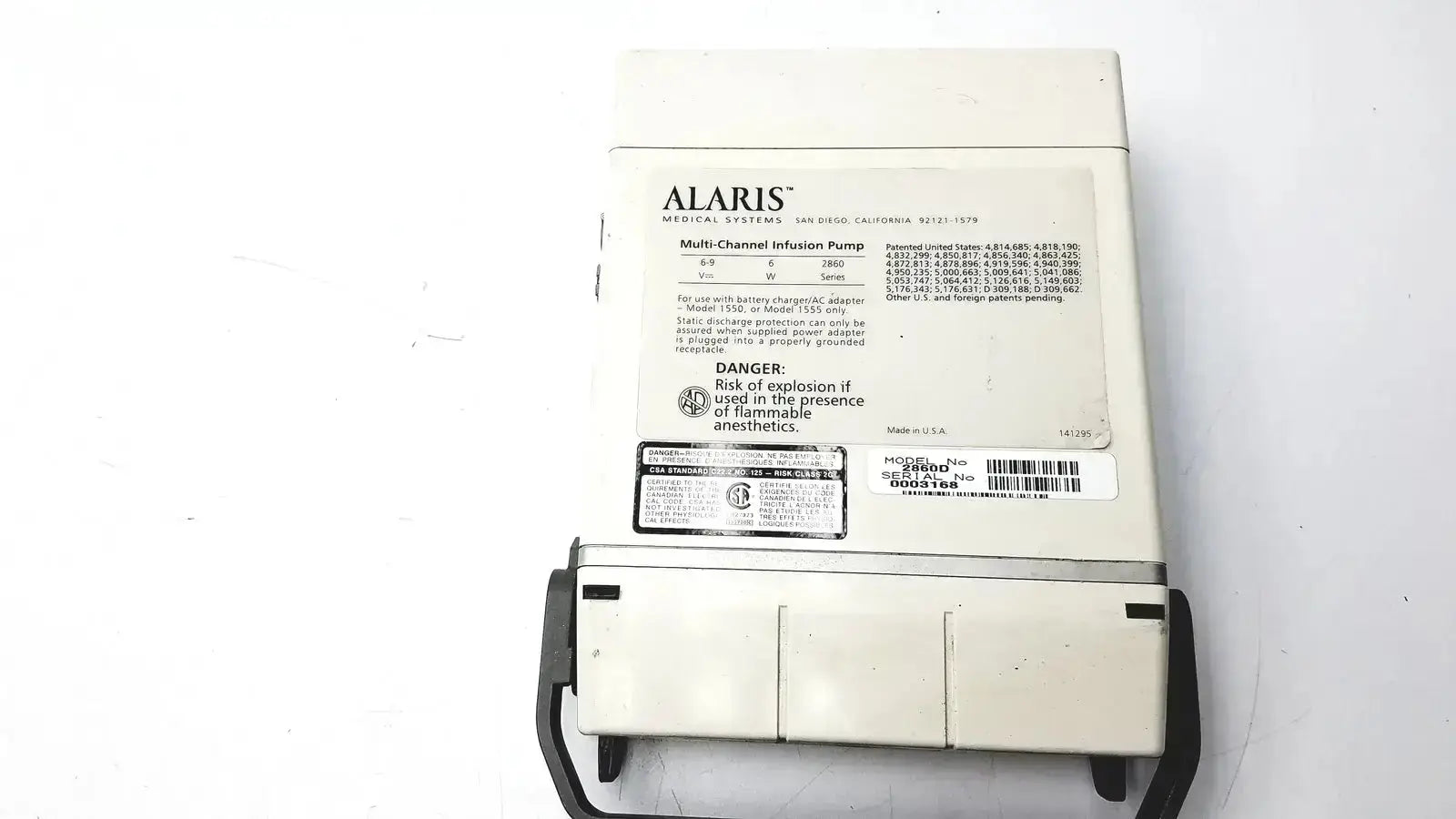 White alaris multi-channel infusion pump with black tubing and model 60u478b label connected to patient monitor 2860d medsystem iii