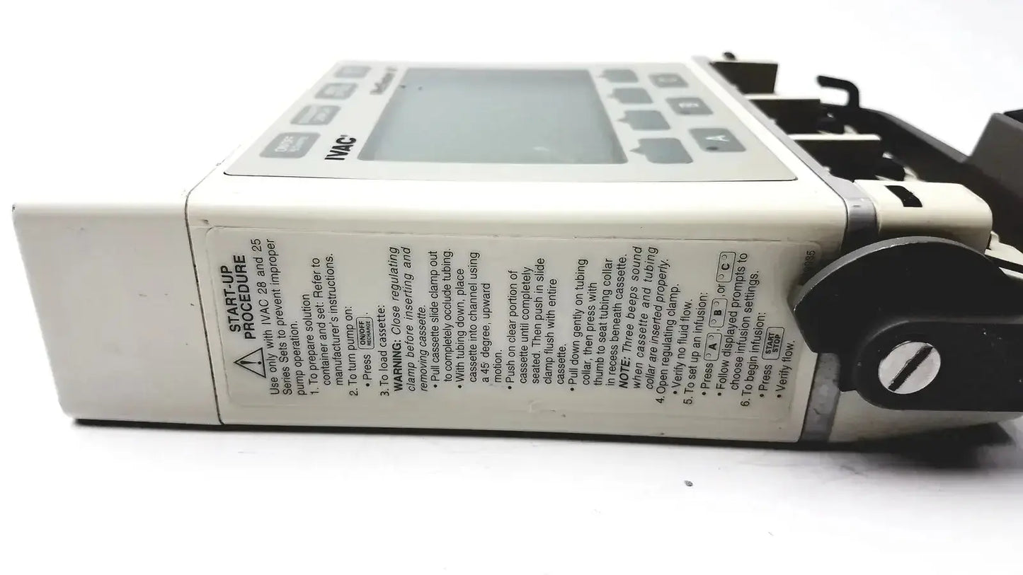 White plastic ivac medsystem iii patient monitor 2860d infusion pump with gray digital display and black control buttons