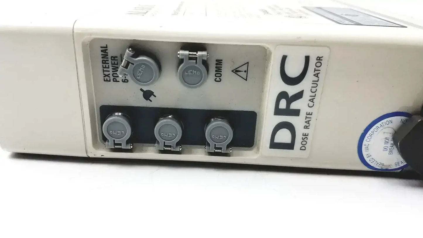 White plastic drc dose rate calculator with gray connectors and blue sticker on the back of patient monitor 2860d medsystem iii