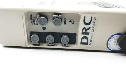 White plastic drc dose rate calculator with gray connectors and blue sticker on the back of patient monitor 2860d medsystem iii