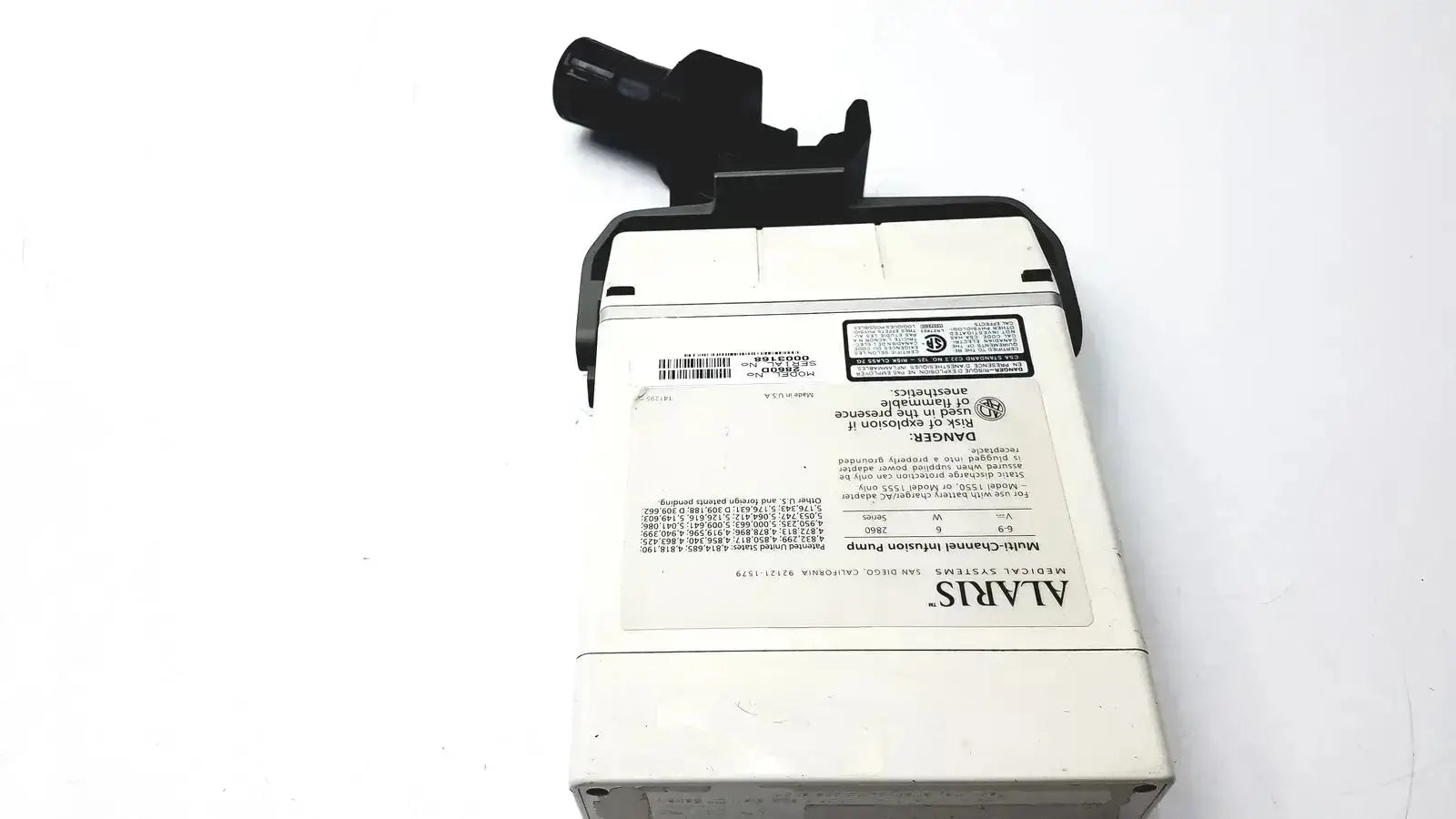 White rectangular alaris ivac medsystem iii patient monitor 2860d with black plastic components and printed labels