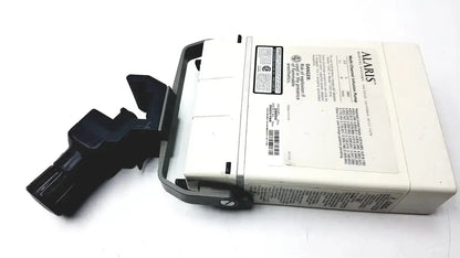 White and black Alaris IVAC Medsystem III patient monitor 2860d medical device with handle grip for clinical use
