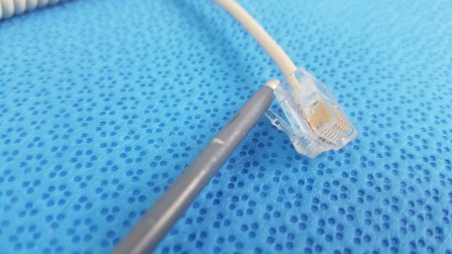 Beige coiled ethernet cable with clear plastic rj45 connector for ivac turbotemp oral temperature probe medical equipment reuse
