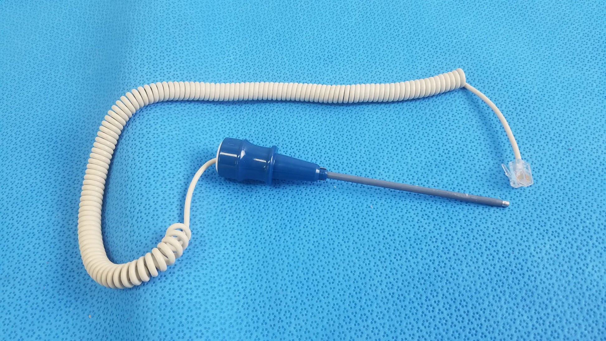 Ivac turbotemp oral temperature probe medical equipment with blue plastic coating white coiled cable and clear rj45 connector