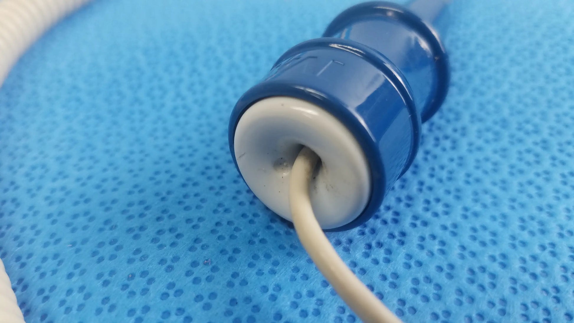 Blue plastic connector with white circular base housing beige cable for ivac turbotemp oral temperature probe medical equipment