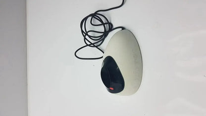 Beige and black ergonomic wired mouse with red logo beside ivoclar vivadent bluephase g2 docking stand