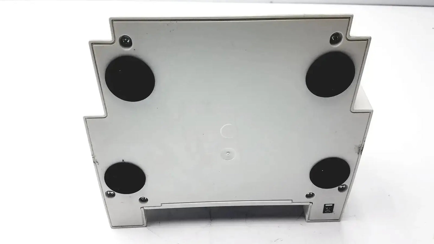 Silver metallic ivoclar vivadent silamat s6 amalgamator with four black circular feet and corner screws for stability