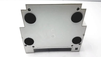 Silver metallic ivoclar vivadent silamat s6 amalgamator with four black circular feet and corner screws for stability