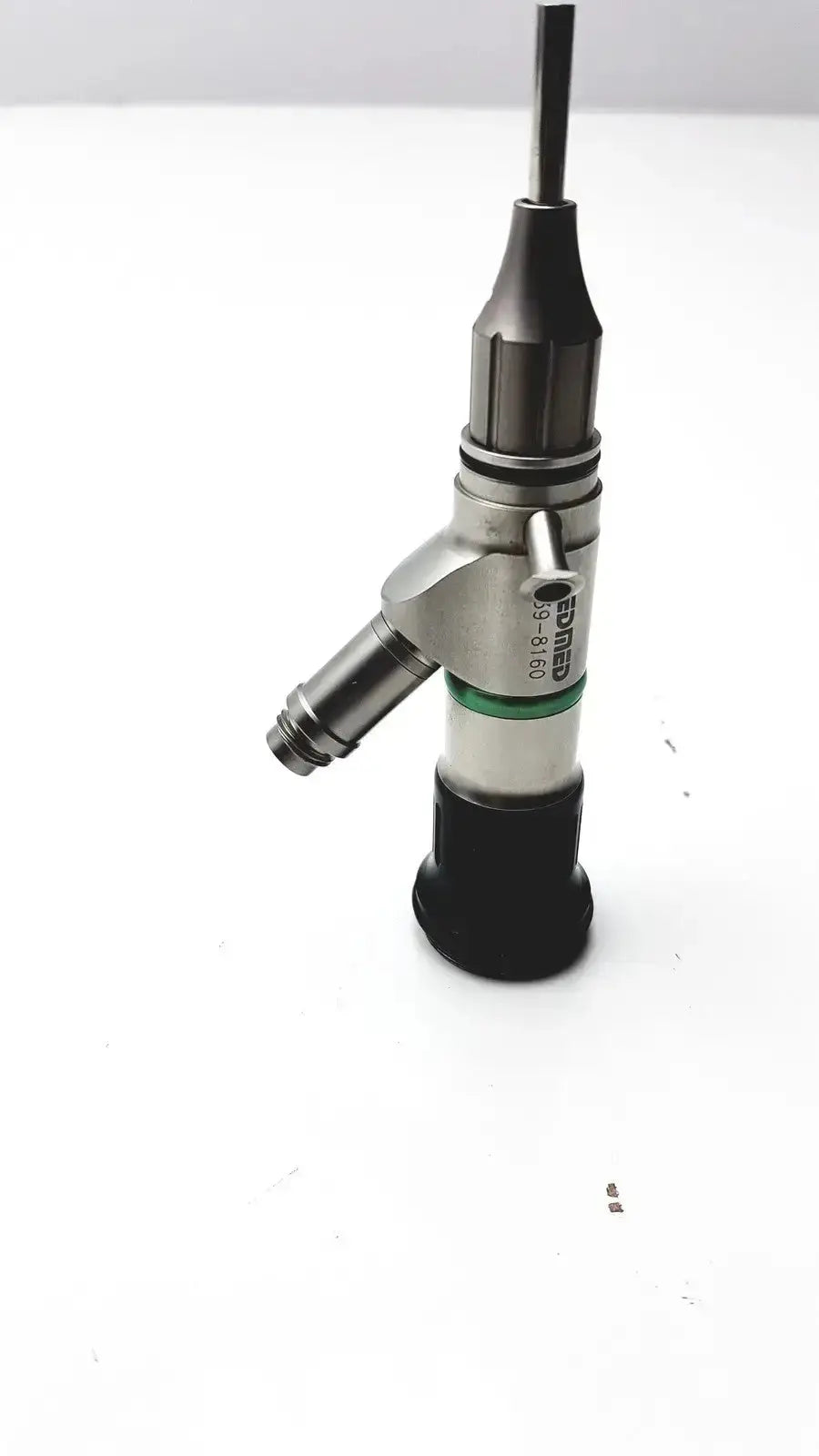 Silver and black JEDMED 39-8160 starmed video otoscope with a green band near the base for medical examination
