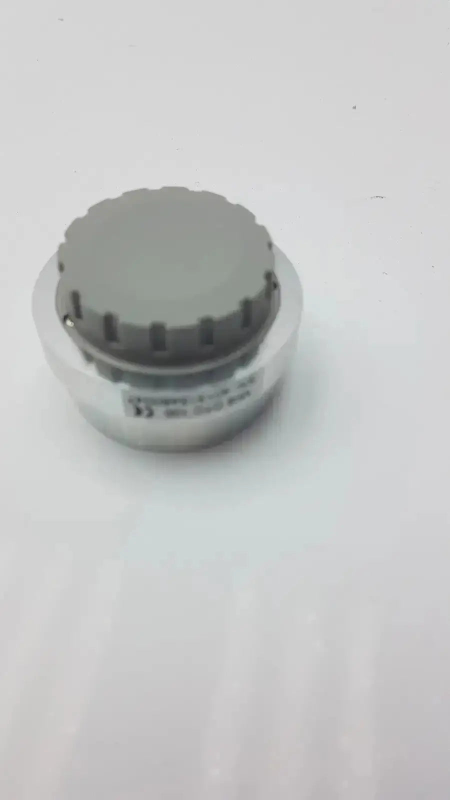 Gray and silver cylindrical sensor with textured top cap for jedmed horus dental lens dtc 100 gmd601000032