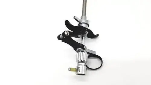 Black and silver karl storz 27094p optical kidney stone grasper with clamp grip and adjustable metallic shaft