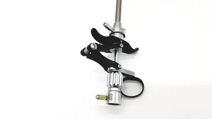 Black and silver karl storz 27094p optical kidney stone grasper with clamp grip and adjustable metallic shaft