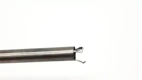 Close-up of the metallic end with two curved hooks of the karl storz 27094p optical kidney stone grasper tool