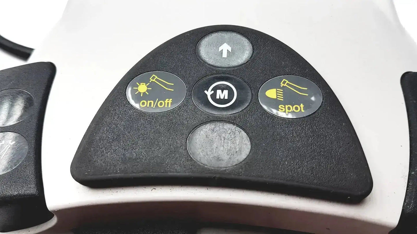 Black triangular control panel with four yellow icon buttons for on off m mode up arrow and spot light on kavo intrasurg 300 dental implant drill