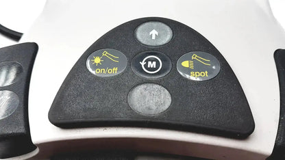 Black triangular control panel with four yellow icon buttons for on off m mode up arrow and spot light on kavo intrasurg 300 dental implant drill