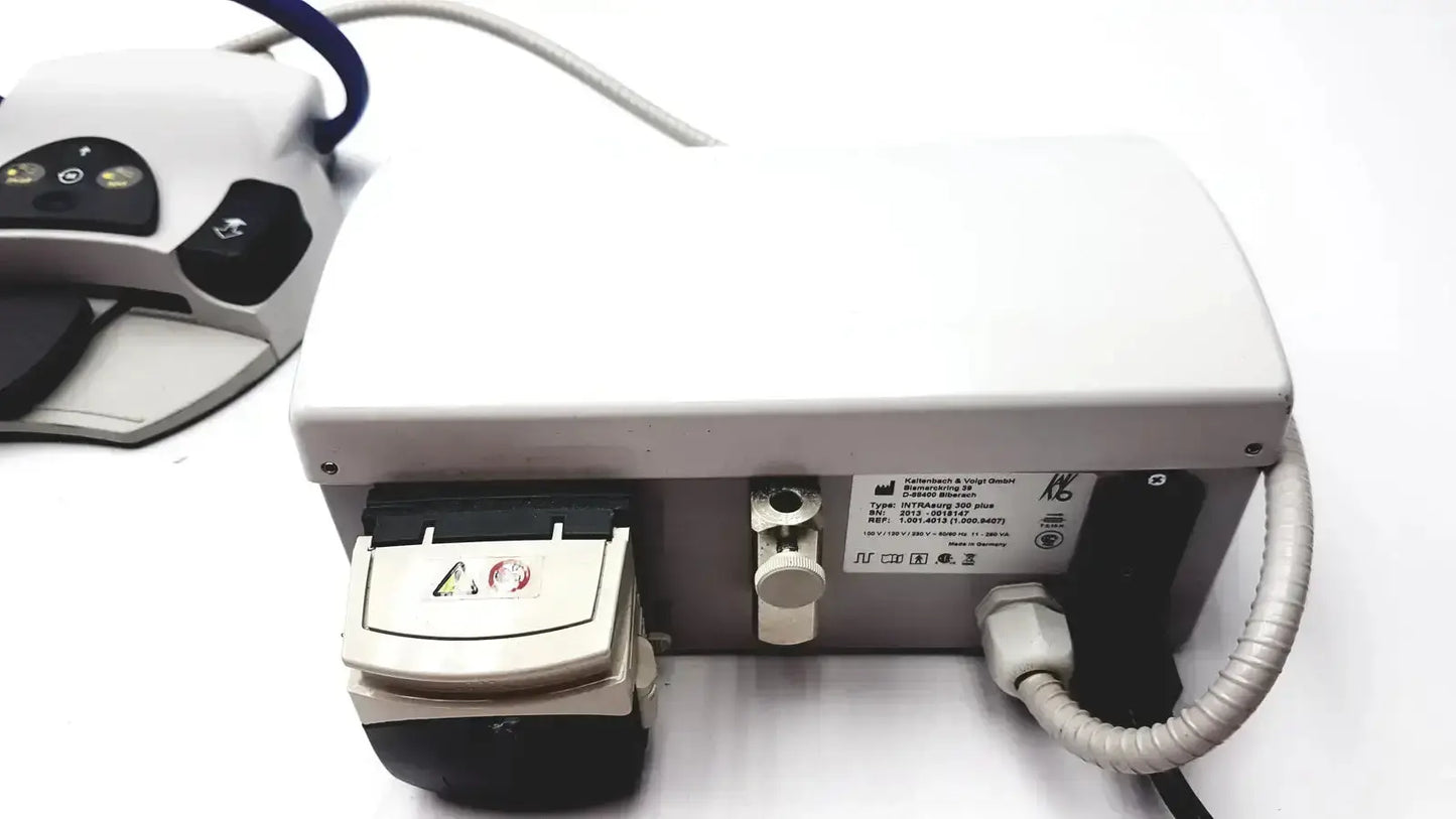 White Kavo Intrasurg 300 dental implant drill with black accents and coiled gray cable for surgical use