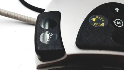 Black plastic control panel with two circular buttons and yellow on off sticker for kavo intrasurg 300 dental implant drill
