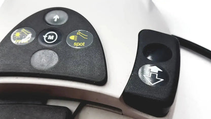 Black control panel with yellow circular buttons on white kavo intrasurg 300 dental implant drill foot control device