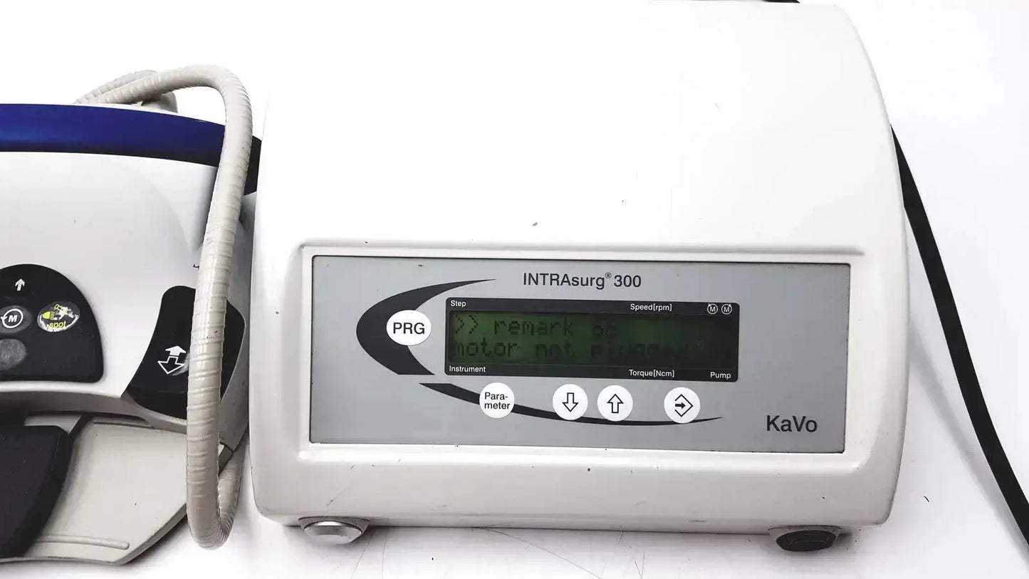 White plastic kavo intrasurg 300 dental implant drill with gray control panel and digital display for surgical use