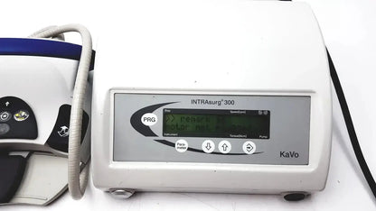 White plastic kavo intrasurg 300 dental implant drill with gray control panel and digital display for surgical use