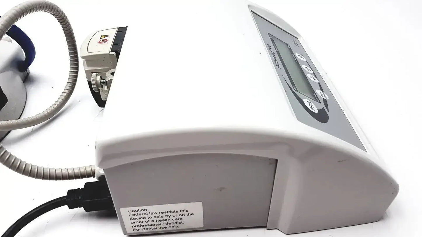 White plastic kavo intrasurg 300 dental implant drill with gray control panel and digital display for surgical use