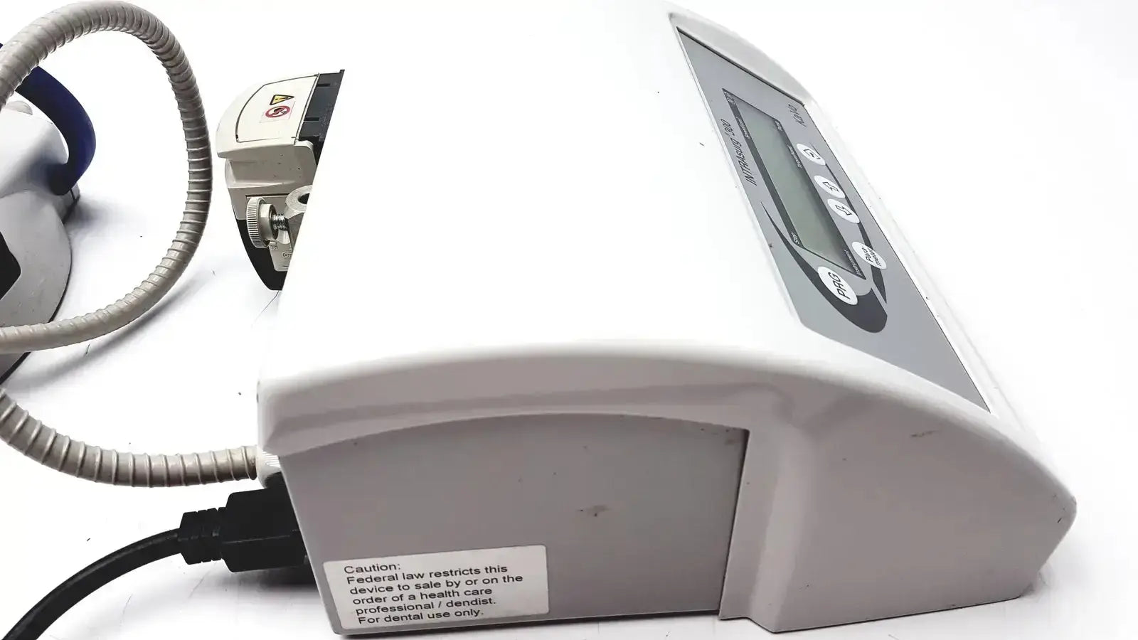 White plastic kavo intrasurg 300 dental implant drill with gray control panel and digital display for surgical use