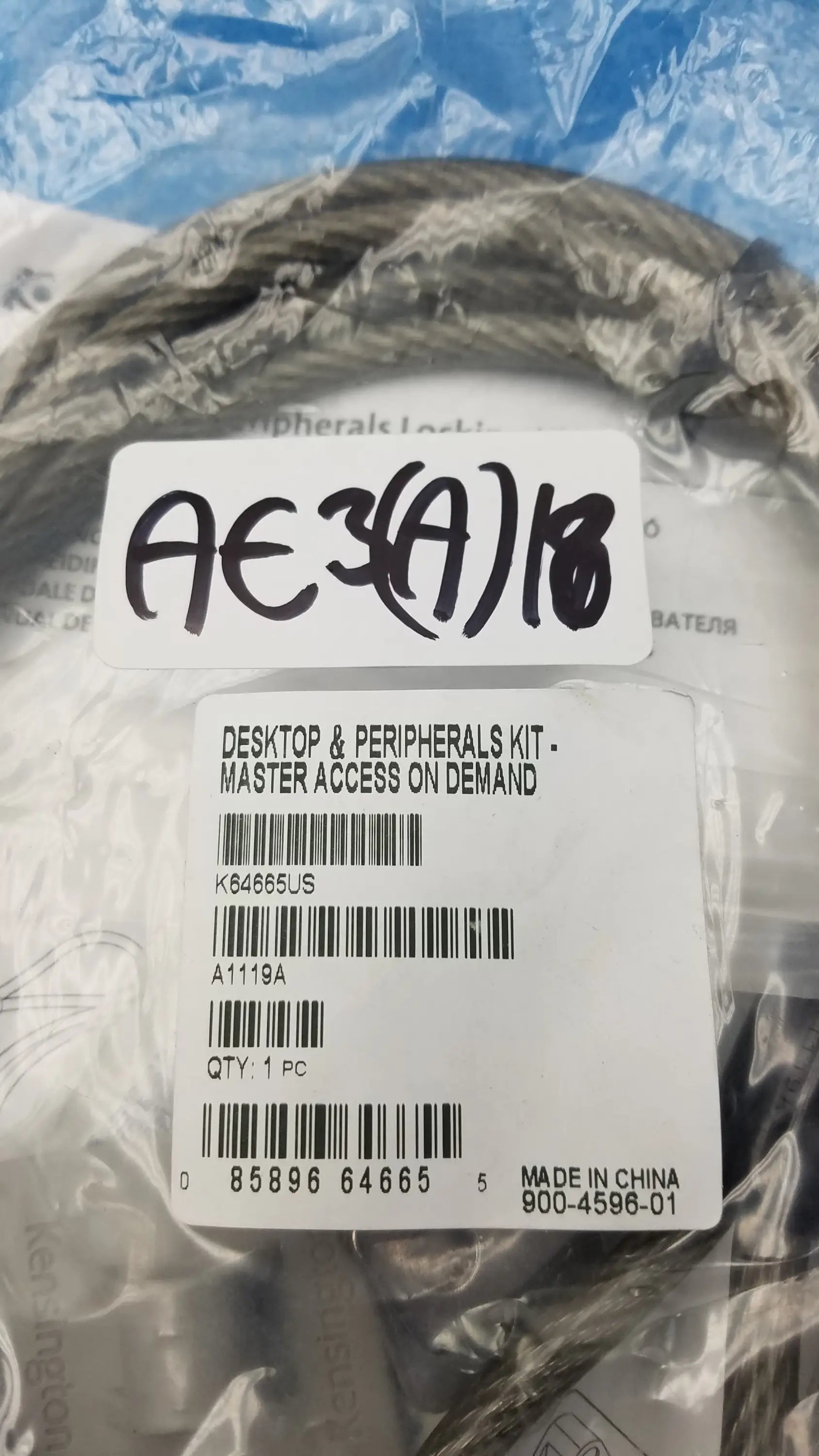 A coiled black cable in clear plastic labeled desktop and peripherals kit for Kensington K64665US locking kit buy used medical equipment