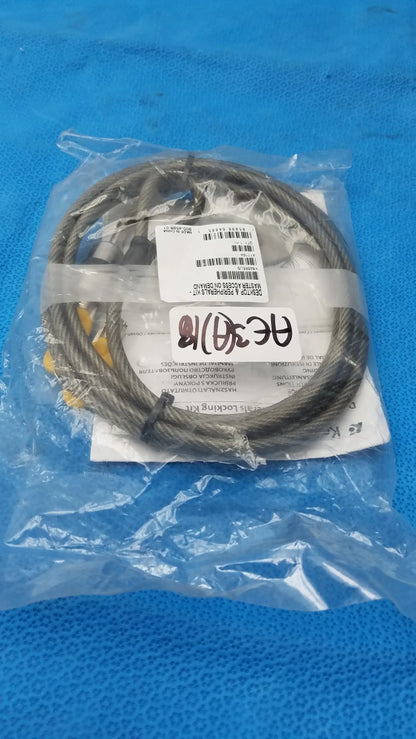 A coiled dark gray steel cable with yellow end fittings in clear plastic packaging for kensington desktop lock kit used medical equipment for sale