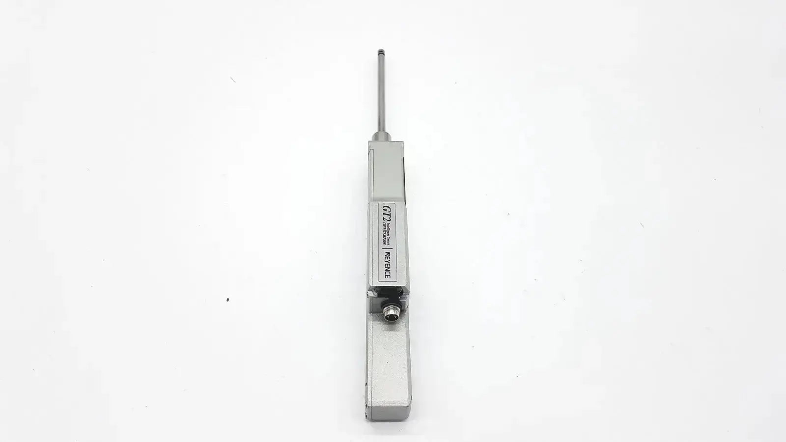 Silver metallic door closer with cylindrical rod and engraved labeling from keyence gt2-h50 intelligent series contact sensor