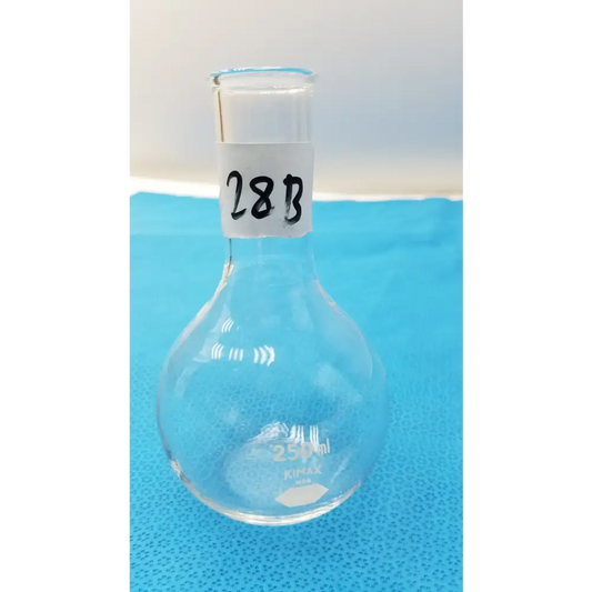 Clear glass 250ml round-bottom flask with a narrow neck and white label marked ’28b’ near the top.