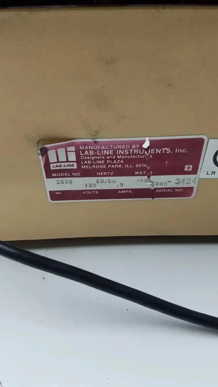 Maroon and white label on cardboard box for lab-line orbit mixer shaker model 3520 by lab-line instruments inc