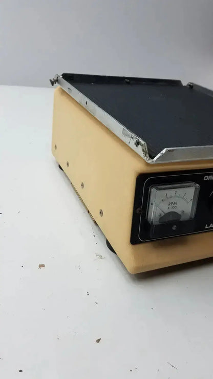 Beige plastic lab-line orbit mixer shaker model 3520 with black top plate and analog rpm gauge for lab use
