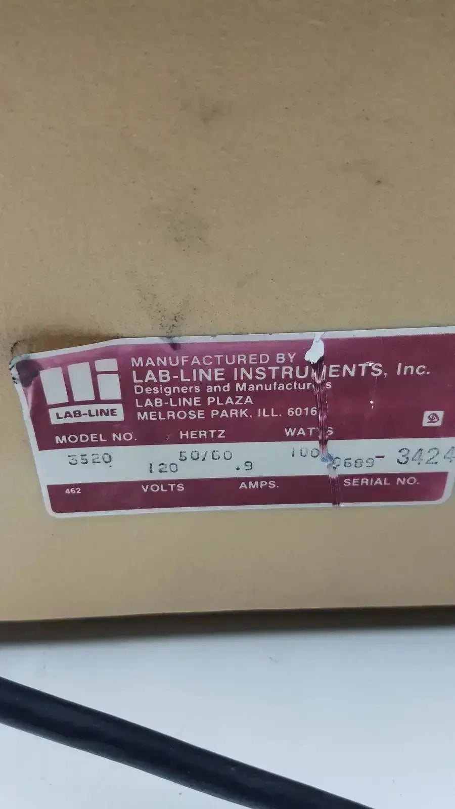 Maroon label on cardboard box for lab-line orbit mixer shaker model 3520 used for laboratory mixing applications